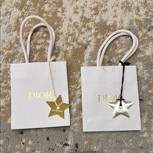 TWO mini Dior shopping bags